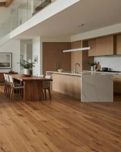 Kitchen and dining room with warm hardwood floor, showing the right flooring decision for a North Carolina home