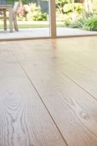 Homeowner saving money with quality flooring installation - Ortiz Flooring NC