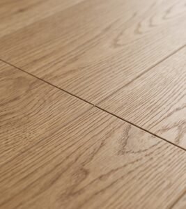 Close-up of luxury vinyl plank installation showing wear layer detail for active families and pets in North Carolina